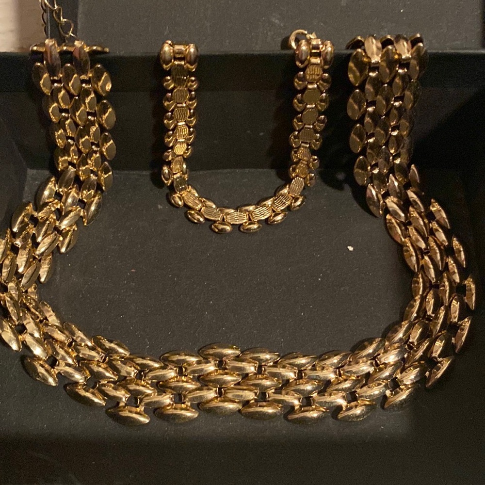 Two piece, gold tone, necklace, and bracelet set